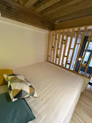 Un ou plusieurs lits dans un hébergement de l'établissement Appartement Canut Lyon Croix-Rousse