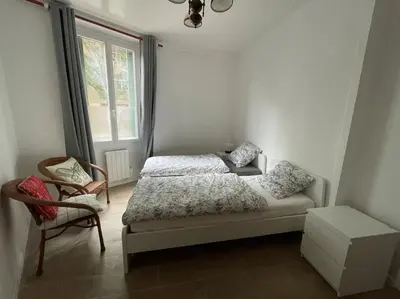 Un ou plusieurs lits dans un hébergement de l'établissement Appartement Charpenne