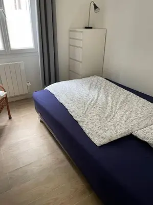 Un ou plusieurs lits dans un hébergement de l'établissement Appartement Charpenne