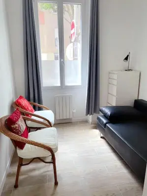 Coin salon dans l'établissement Appartement Charpenne