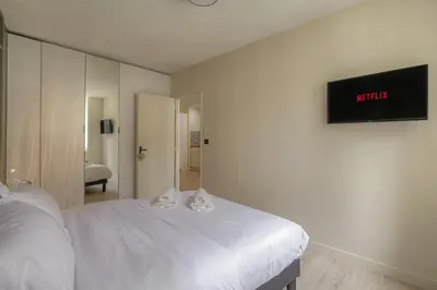 Un ou plusieurs lits dans un hébergement de l'établissement La suite Guillaume, T2 cosy contemporain