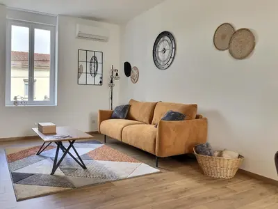 Coin salon dans l'établissement Appartement Zen & Cosy