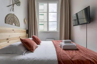 Un ou plusieurs lits dans un hébergement de l'établissement SmartStay Bon Pasteur- Croix rousse