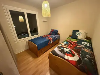 Un ou plusieurs lits dans un hébergement de l'établissement Appartement spacieux