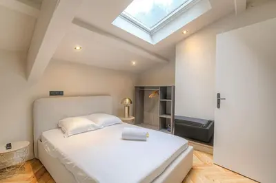 Un ou plusieurs lits dans un hébergement de l'établissement Charmant appartement en duplex pour 4, St-Didier