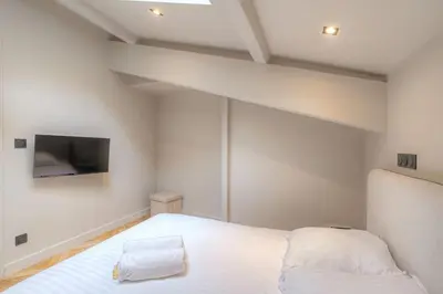 Un ou plusieurs lits dans un hébergement de l'établissement Charmant appartement en duplex pour 4, St-Didier