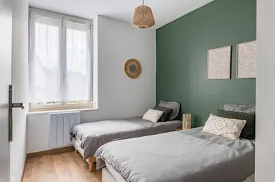 Un ou plusieurs lits dans un hébergement de l'établissement Le Louisa - Cosy et chic 30 min LYON