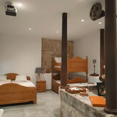 Un ou plusieurs lits dans un hébergement de l'établissement Gites du Longevent Appartement du Moulin Pérouges
