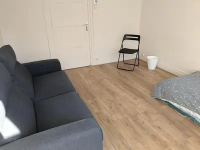 Coin salon dans l'établissement Chambre confortable au calme et proche du centre-ville de Lyon