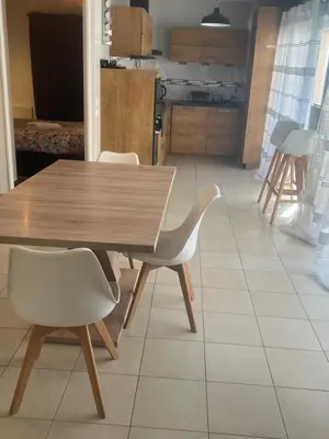 Cuisine ou kitchenette dans l'établissement Cosy appartement