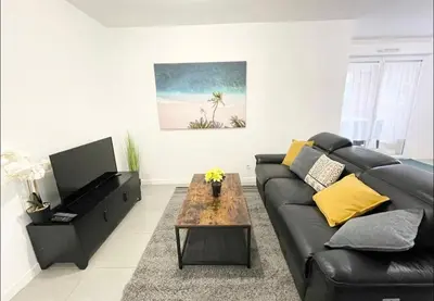 Coin salon dans l'établissement Appartement - Le Salengro