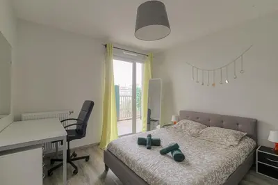 Un ou plusieurs lits dans un hébergement de l'établissement T3 calme & lumineux - idéal familles & pros à Villeurbanne