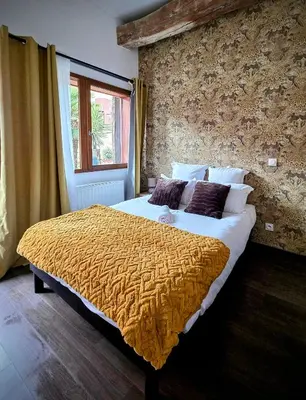 Un ou plusieurs lits dans un hébergement de l'établissement Le Clos des Roses - Chambre d'hôtes