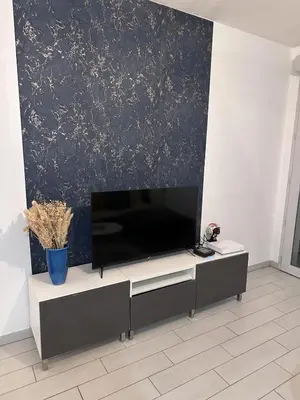 Télévision ou salle de divertissement dans l'établissement Le Soyeux