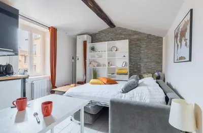 Un ou plusieurs lits dans un hébergement de l'établissement Le Studio Ivry - Lyon Croix Rousse