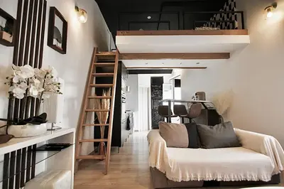 Coin salon dans l'établissement Pied à terre - Mezzanine studio - Private parking