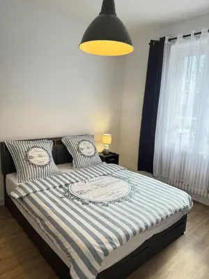 Un ou plusieurs lits dans un hébergement de l'établissement Cosy & Design
