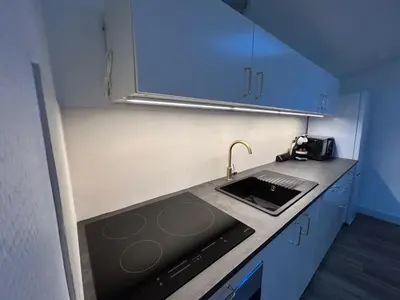 Cuisine ou kitchenette dans l'établissement Le cosy clem