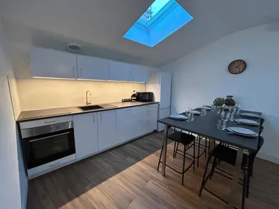 Cuisine ou kitchenette dans l'établissement Le cosy clem