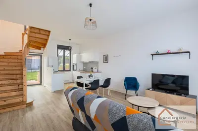 Coin salon dans l'établissement Agréable Maisonnette à Proximité d'Eurexpo