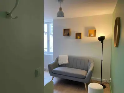 Coin salon dans l'établissement Le Minimaliste, Appartement Hyper Centre Climatisé