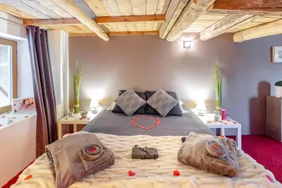 Un ou plusieurs lits dans un hébergement de l'établissement Maison Lili Paradis
