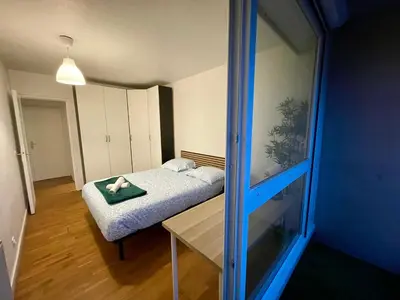 Un ou plusieurs lits dans un hébergement de l'établissement BnGo I Le Spacieux I 12 personnes, 5 chambres, 2 salle de bain, parking privé, WC séparé, Wifi