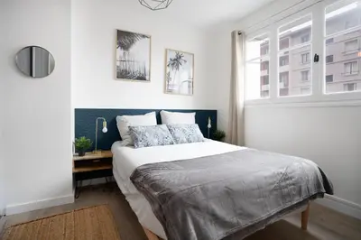 Un ou plusieurs lits dans un hébergement de l'établissement L'Abri Citadin - Deux chambres