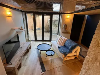 Coin salon dans l'établissement Charmant Duplex