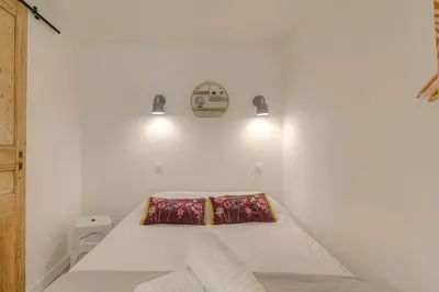 Un ou plusieurs lits dans un hébergement de l'établissement Le Morgon, Studio Confort, proximité Villefranche Centre