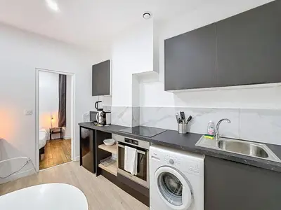 Cuisine ou kitchenette dans l'établissement My Home Saint Jérome 2
