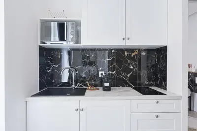 Cuisine ou kitchenette dans l'établissement LES BULLES DE MONA - Lila - Spa - Clim