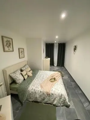 Un ou plusieurs lits dans un hébergement de l'établissement Cosy Home avec Spa - Proximité airport, CNPE, Eurexpo, Groupama Stadium, LYON
