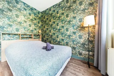 Un ou plusieurs lits dans un hébergement de l'établissement Studio Tête d 'Or