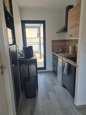 Cuisine ou kitchenette dans l'établissement Appartement 1 chambre et terrasse