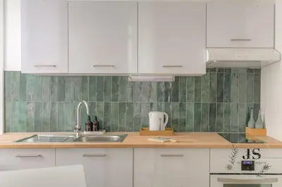Cuisine ou kitchenette dans l'établissement Le Dauphiné studio climatisé