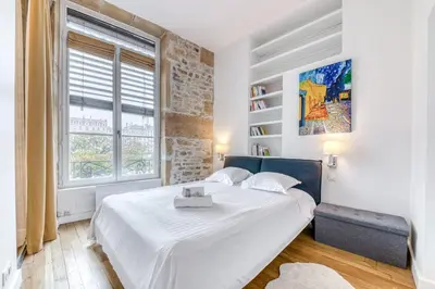 Un ou plusieurs lits dans un hébergement de l'établissement Elegant 2-room apartment in the heart of Lyon - Nomad by Welkeys