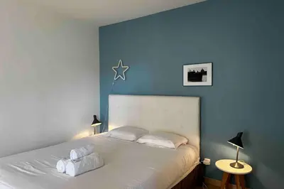 Un ou plusieurs lits dans un hébergement de l'établissement Cosy studio Lyon 1er Croix Rousse