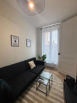 Coin salon dans l'établissement Le Charmant - Proche Gare