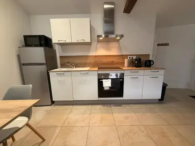 Cuisine ou kitchenette dans l'établissement Saint Amour Appartement T2