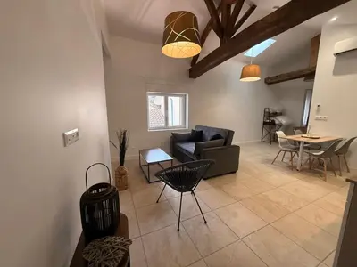 Coin salon dans l'établissement Saint Amour Appartement T2