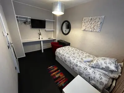 Un ou plusieurs lits dans un hébergement de l'établissement Chambre Mawa Tout Confort
