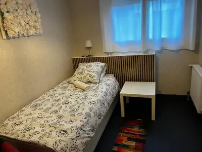 Un ou plusieurs lits dans un hébergement de l'établissement Chambre Mawa Tout Confort