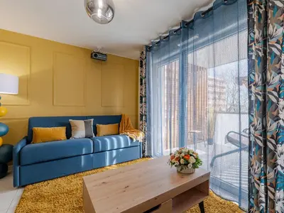 Coin salon dans l'établissement Au Charme Lyonnais classé 3 etoiles