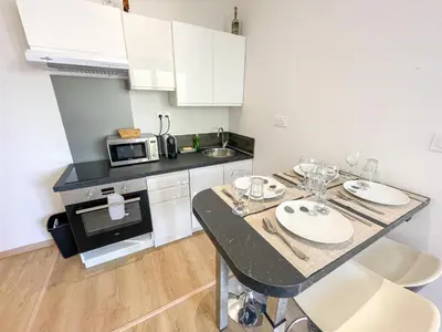 Cuisine ou kitchenette dans l'établissement T2 Sweet Horizon 3 - Groupama, LDLC, Euroexpo, Grand Large
