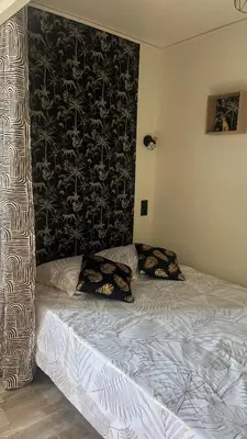 Un ou plusieurs lits dans un hébergement de l'établissement Petit appartement cosy Miribel