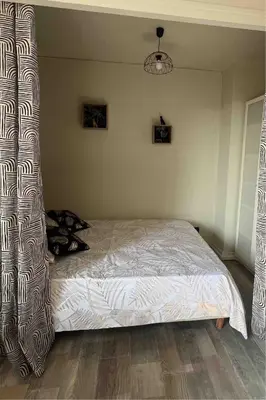 Un ou plusieurs lits dans un hébergement de l'établissement Petit appartement cosy Miribel