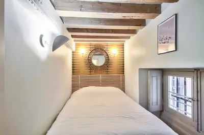 Un ou plusieurs lits dans un hébergement de l'établissement Bel appartement 3 chambres proche Opéra
