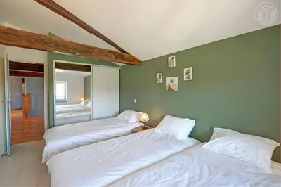 Un ou plusieurs lits dans un hébergement de l'établissement Gite de charme au cœur des Monts du Lyonnais