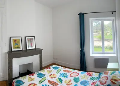 Un ou plusieurs lits dans un hébergement de l'établissement Appartement collonges bord de Saône